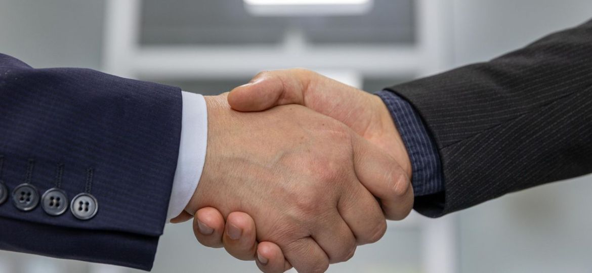 Business handshake signifying partnership